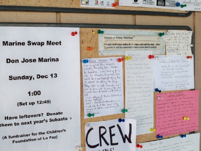 Checking out the notice board at the marina in La Paz, Mexico for a free yacht ride