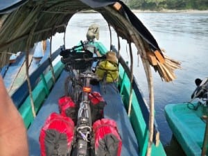 Crossing the river from Mexico to Guatemala with our bicycles