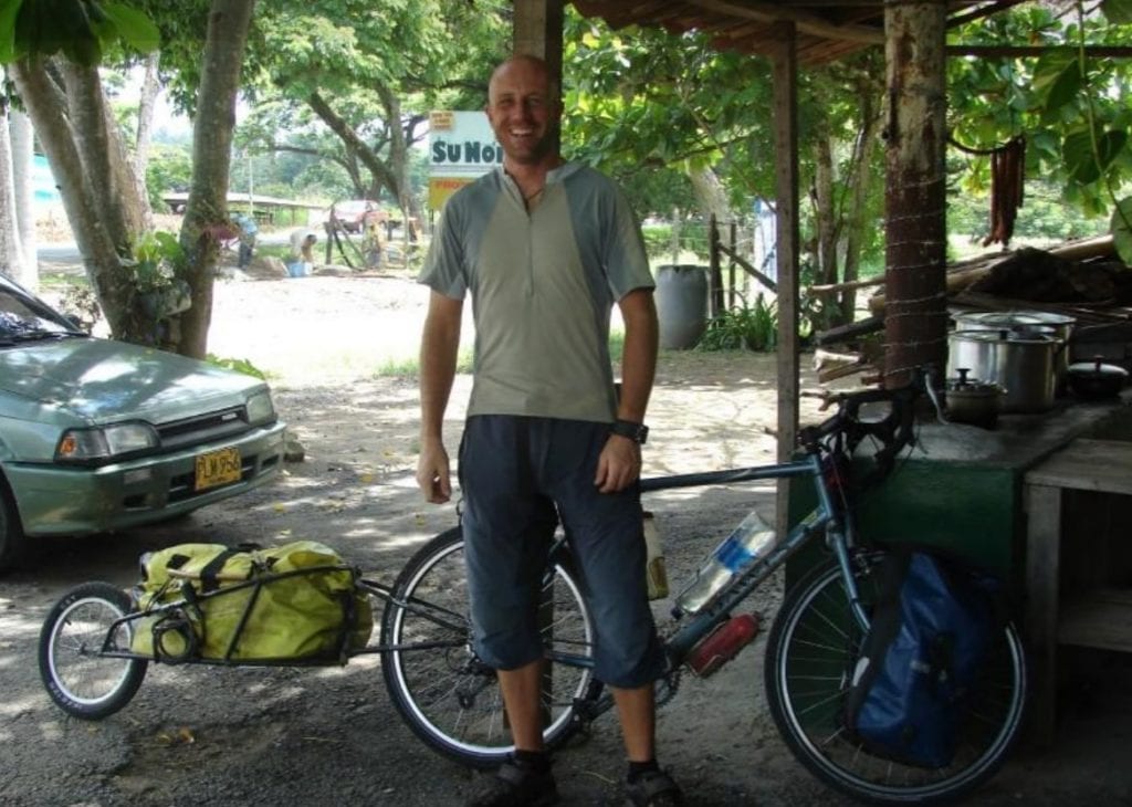Dave Briggs cycling in Colombia with a Bob Yak trailer