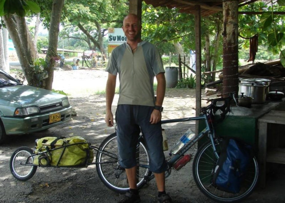Dave Briggs cycling in Colombia with a Bob Yak trailer