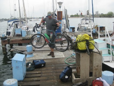 Unloading my bicycle and trailer after arriving by boat in Colombia.