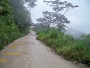 Cycling on a dirt road in the rain in Ecuador