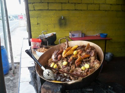 An assortment of pig bits being cooked up for me in a giant wok in Ecuador.