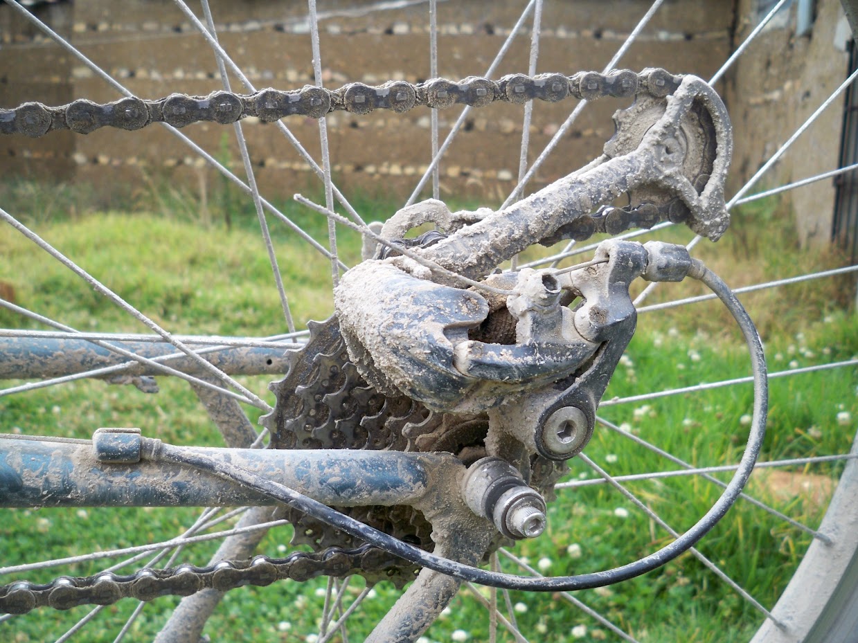Cleaning the chain and derailleur on a bike tour