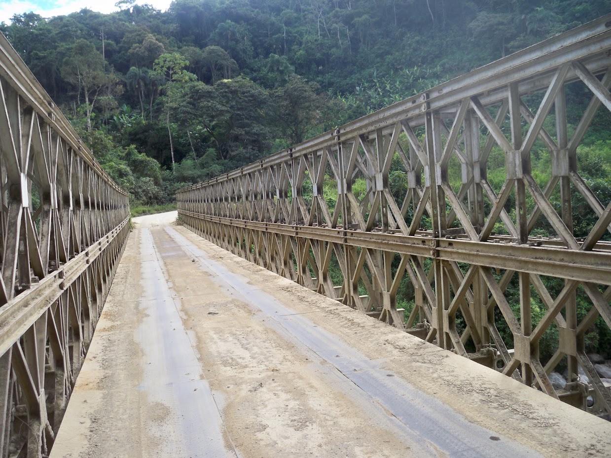 Crossing the bridge by bicycle at Isimanchi in Ecuador