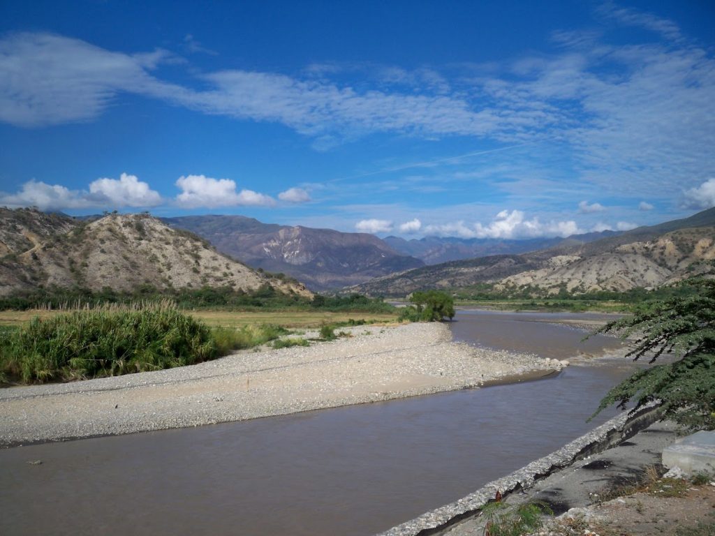 Cycling by a river in Peru