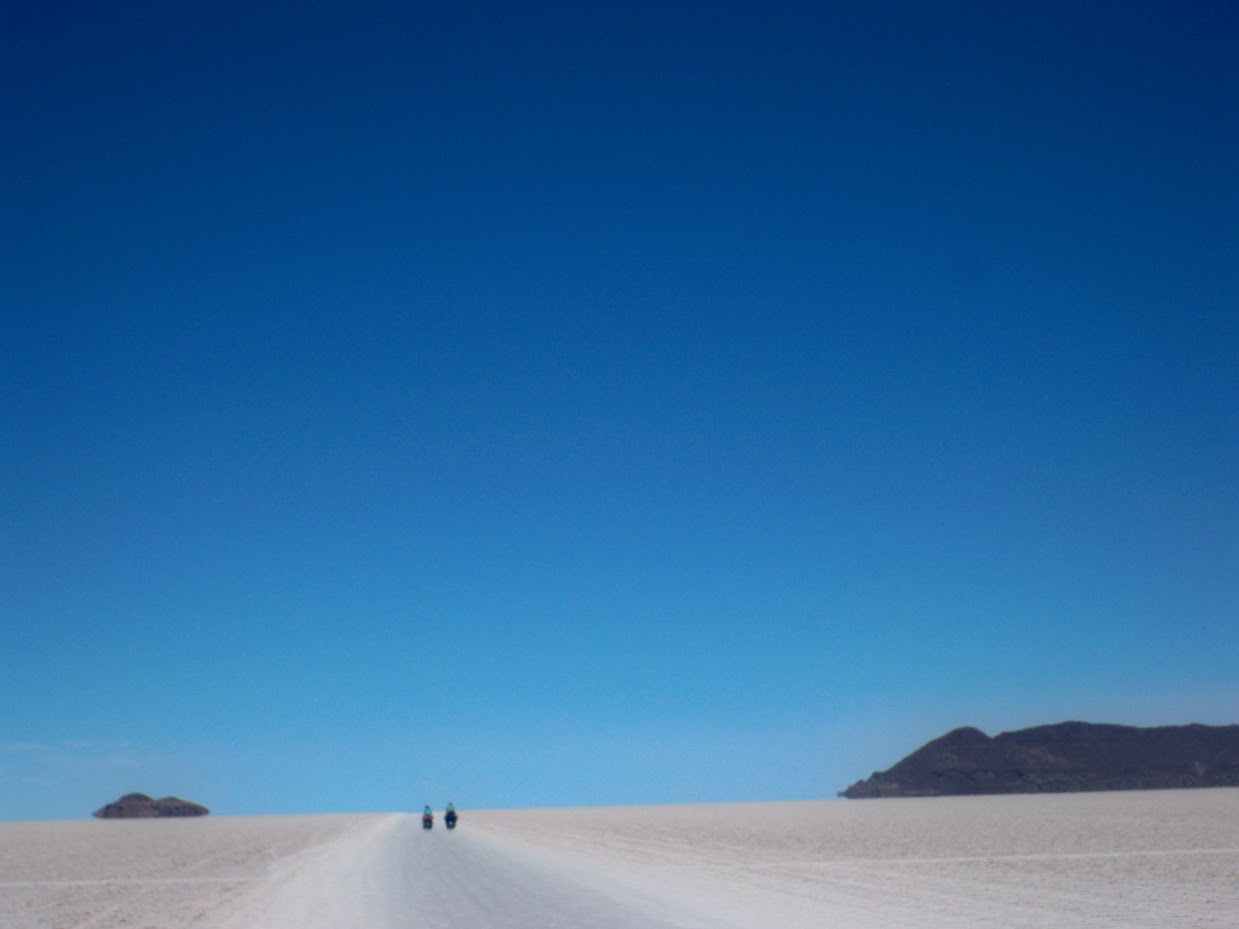 cyclists Llica in Bolivia - cycling across the salt pans