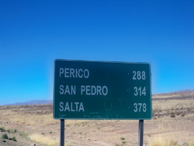 A sign post showing Salta in Argentina