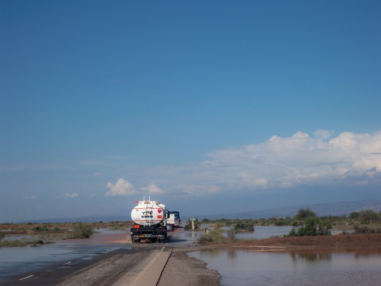 Cycling a flooded road near Mendoza in Argentina