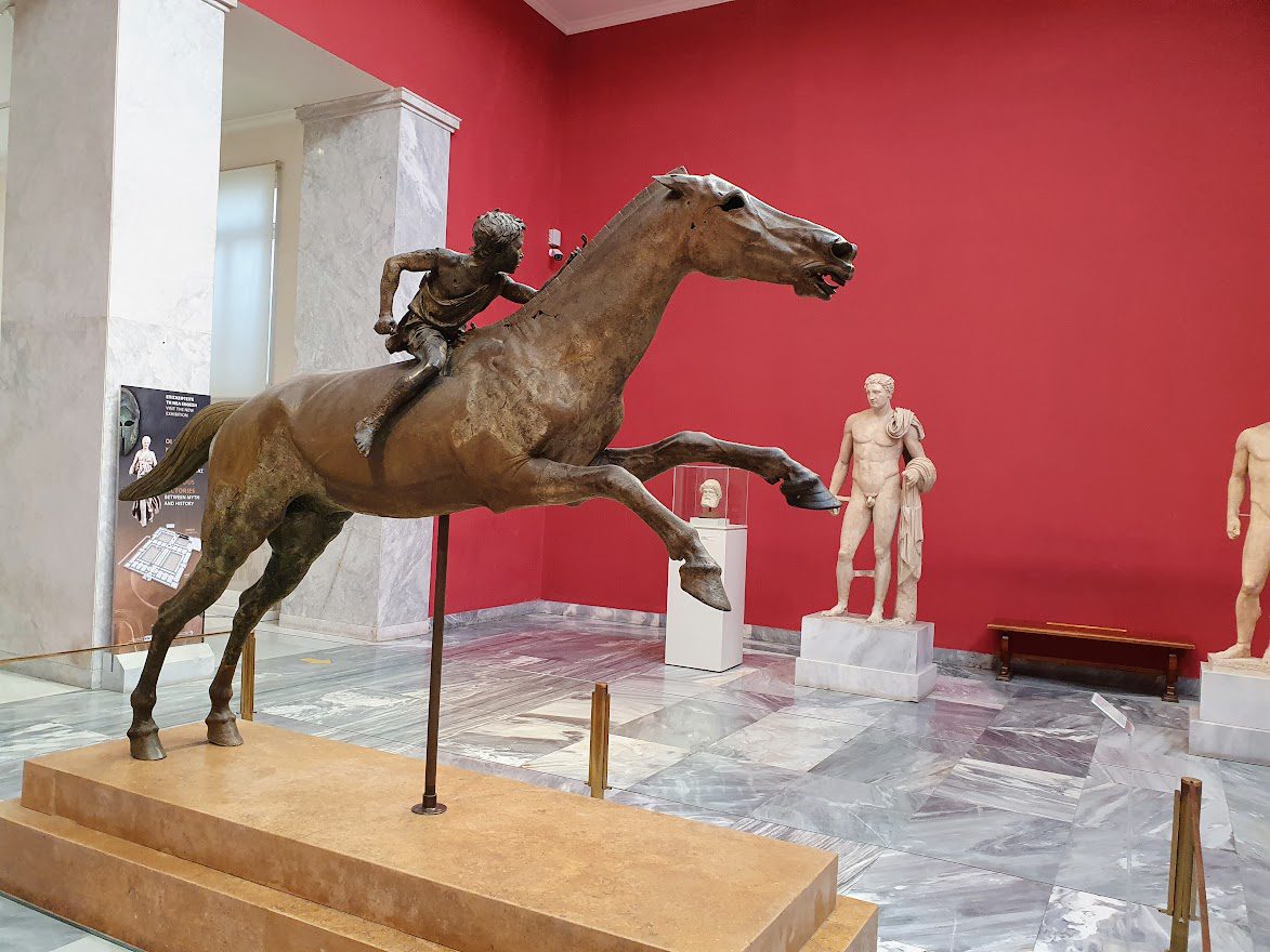 The Horse and Jockey bronze statue in the national archaeological museum in Athens Greece