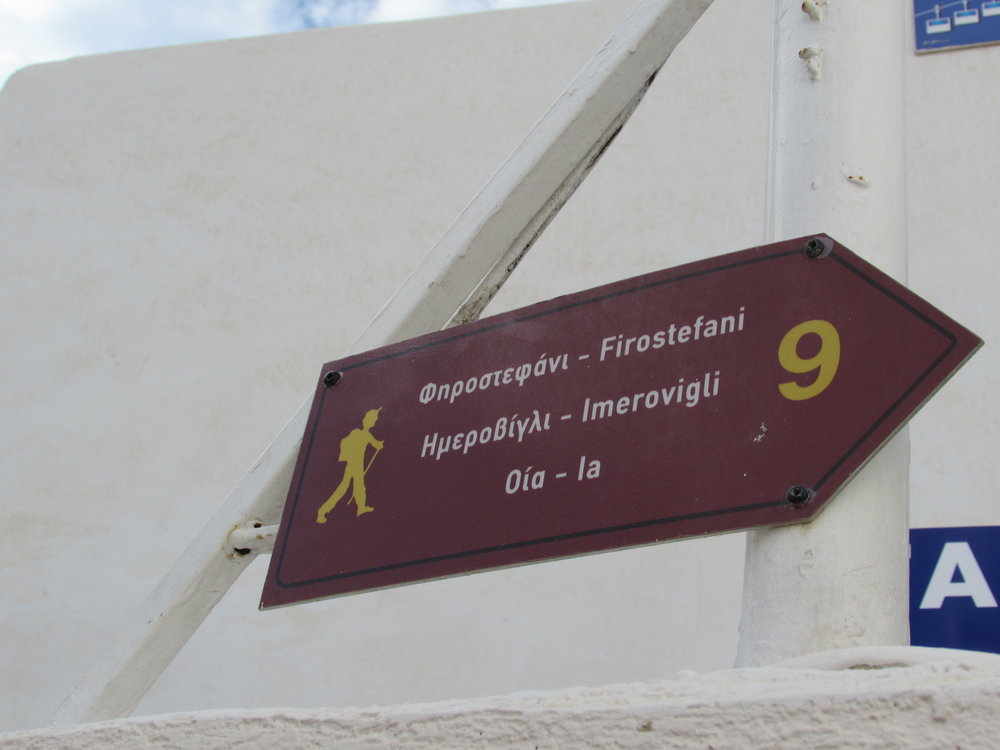A sign for the Fira to Oia hiking trail in Santorini