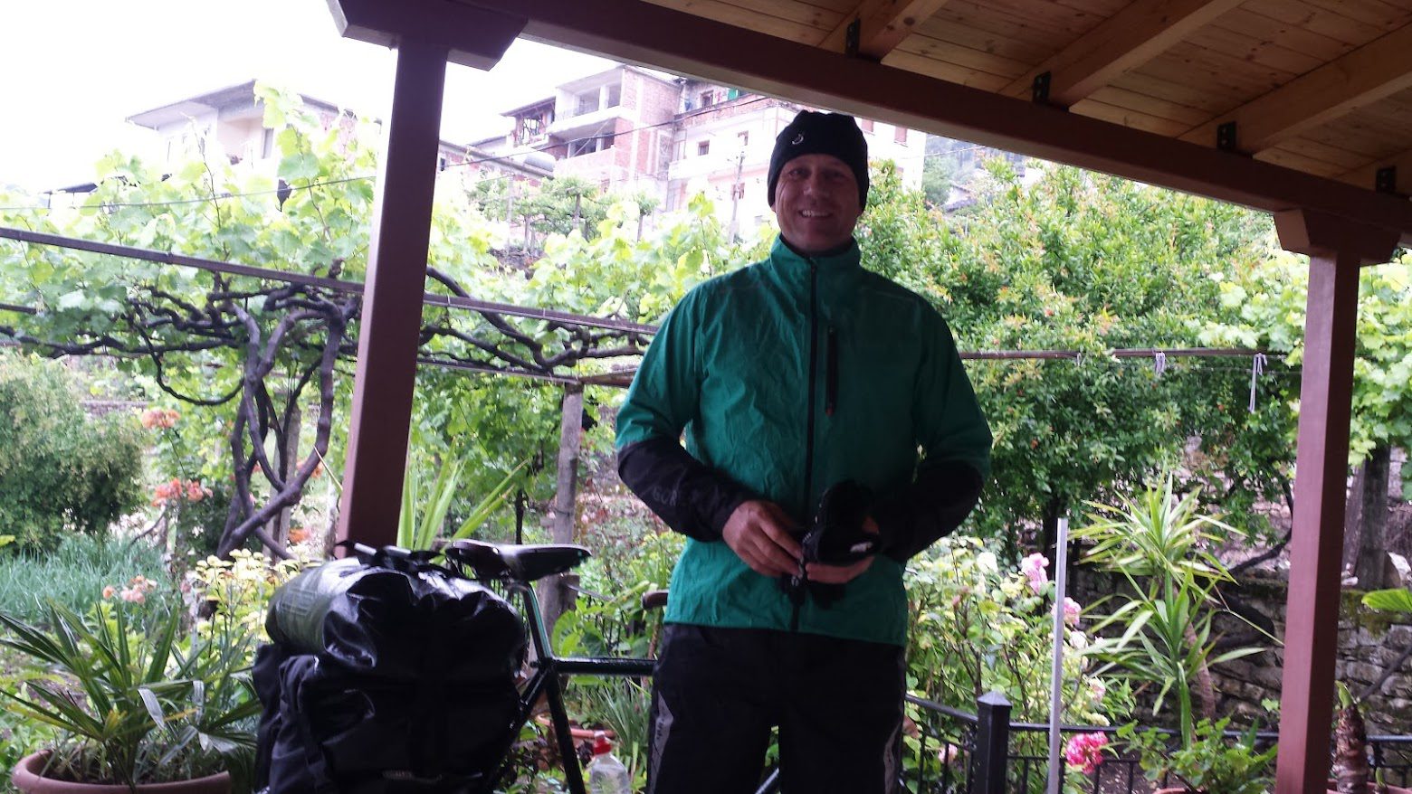 Dave Briggs from Dave's Travel Pages getting ready to cycle in the rain in Albania