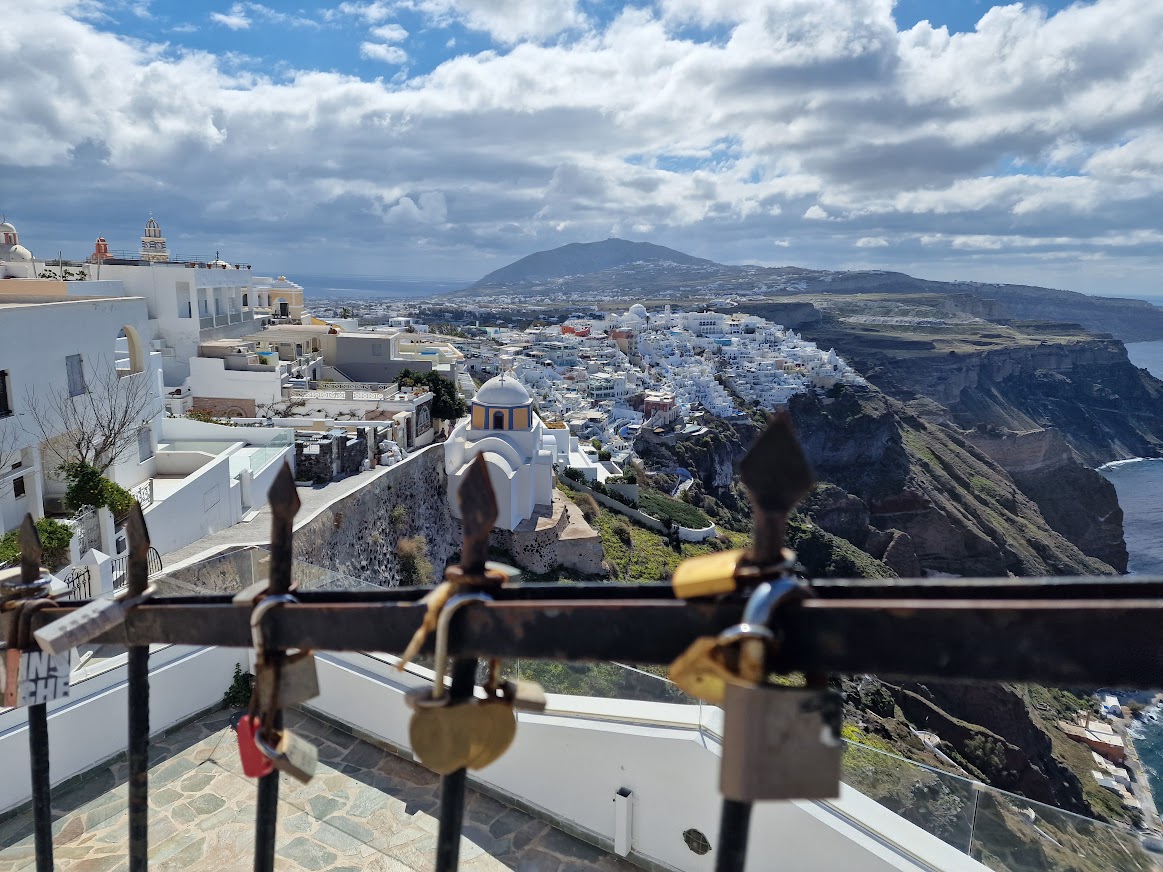 Hiking out of Fira in Santorini where people leave their padlocks on a handrail