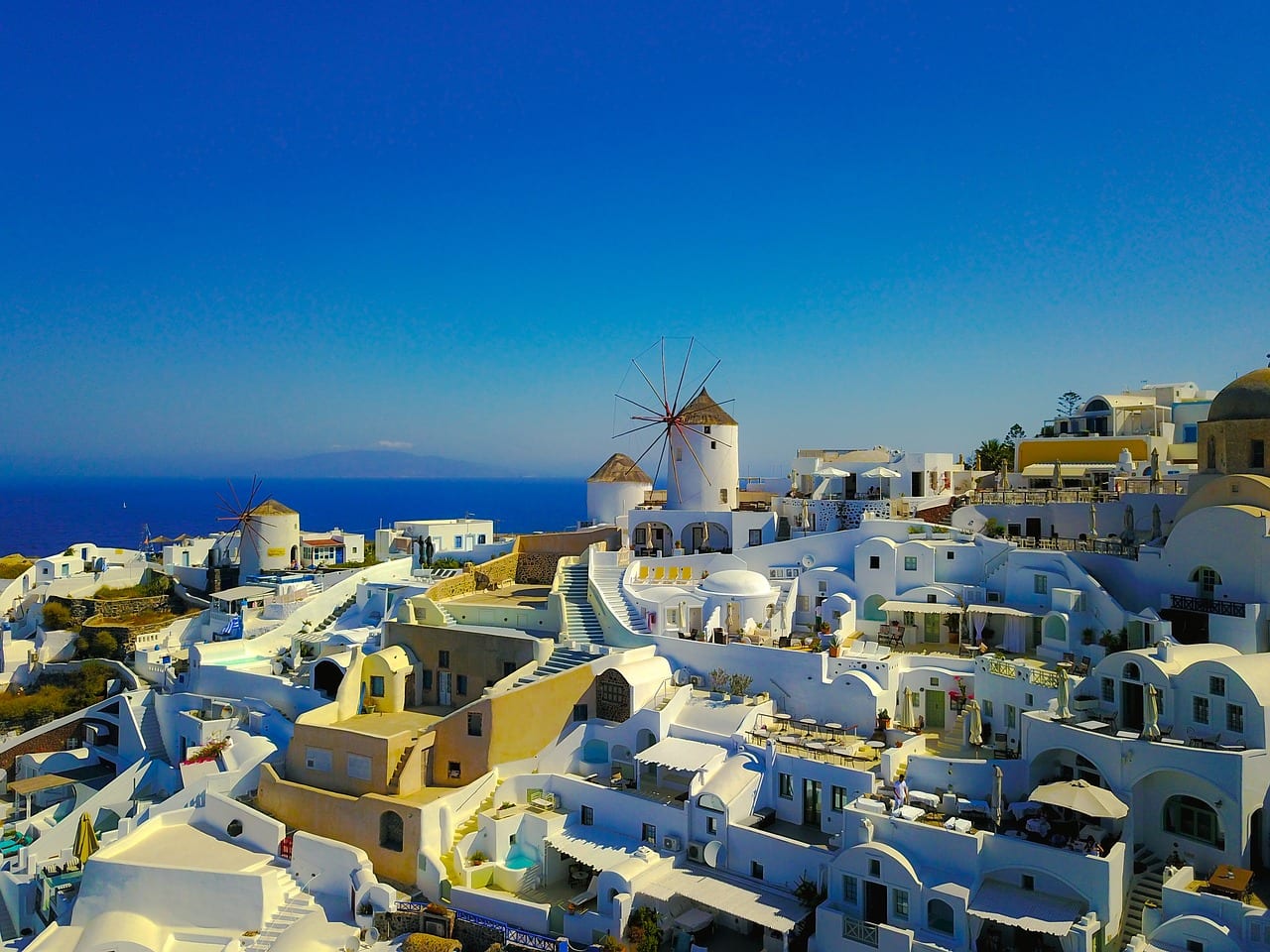 A look at some of the best Santorini excursions, including volcano boat tours, catamaran caldera cruises, and even Santorini helicopter tours!