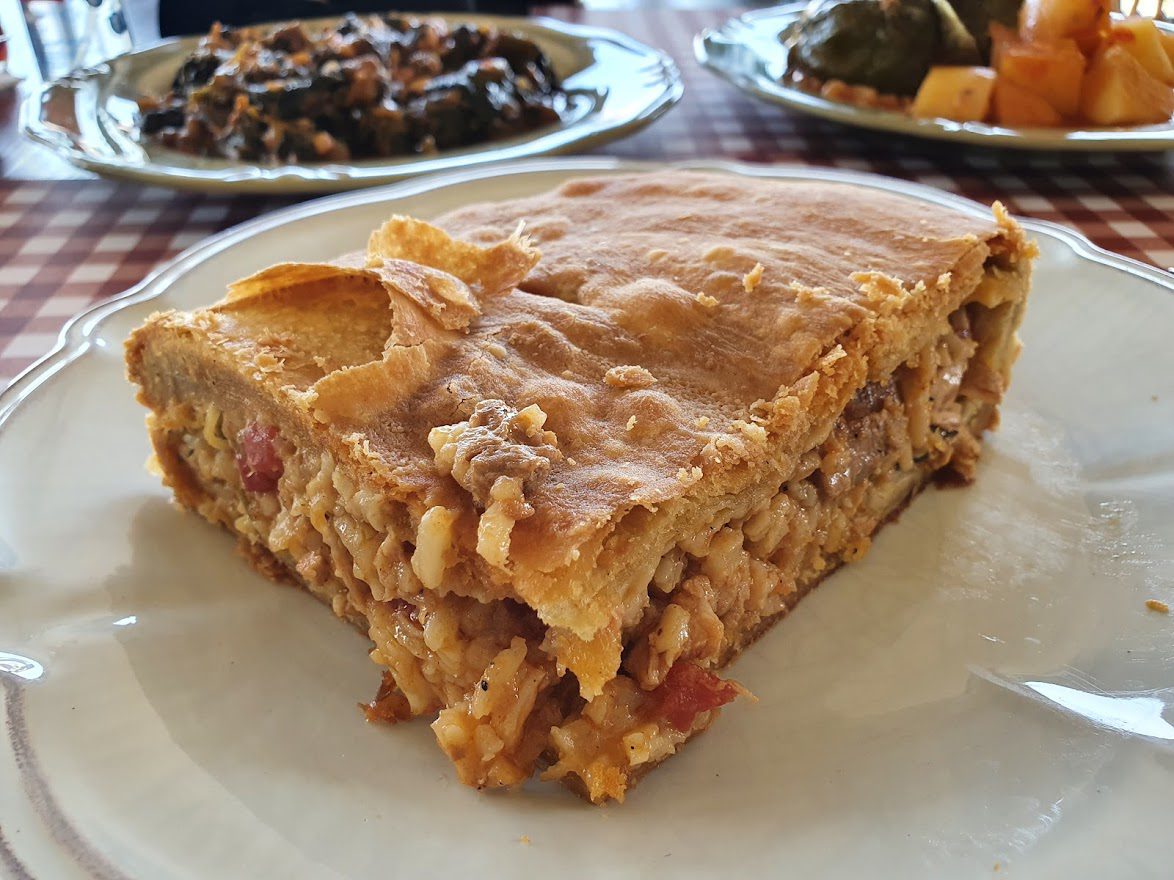 A large slice of Kefalonian Meat Pie