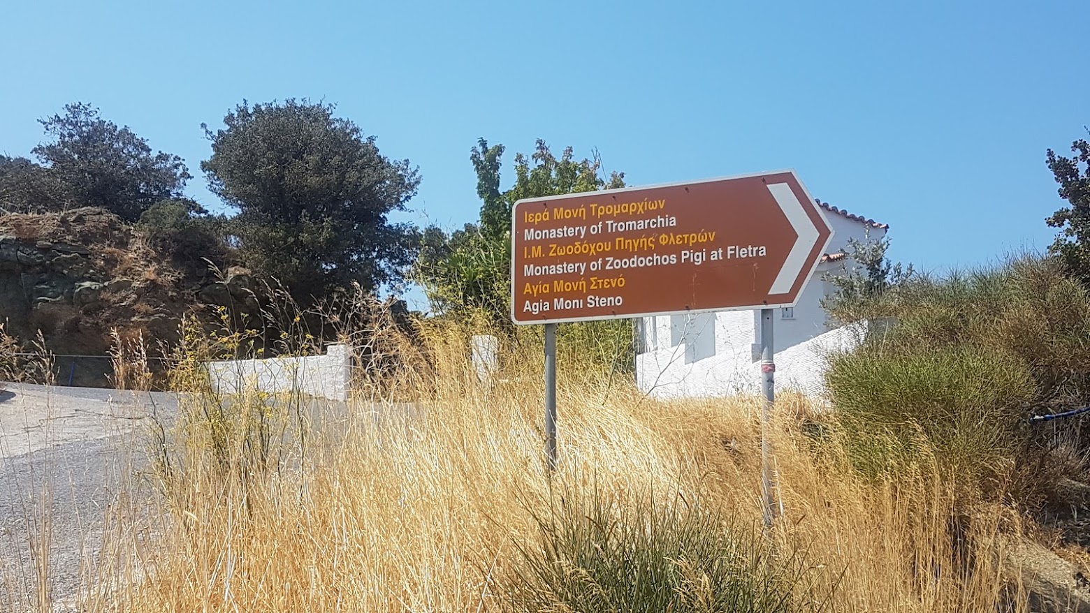 Road sign in Greece in both English and Greek