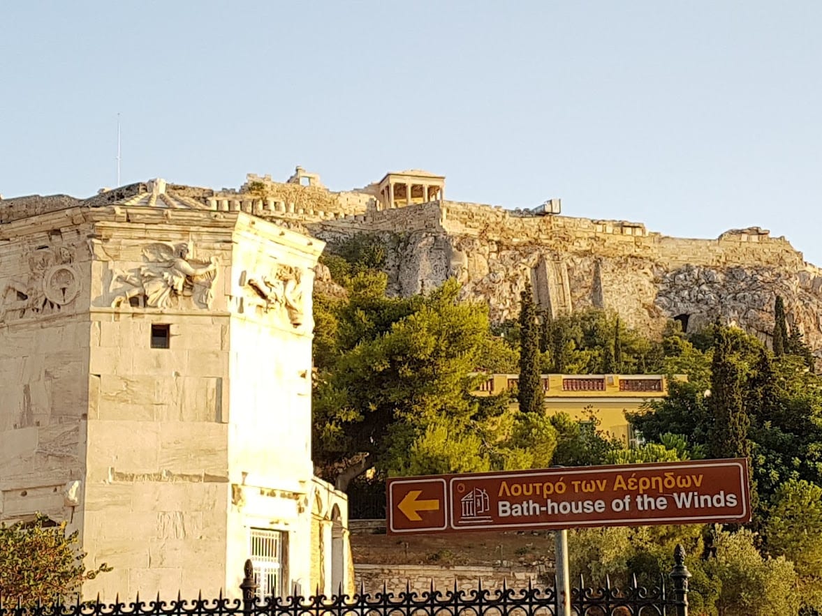 A sign pointing to the bath House of the Winds in Athens Greece
