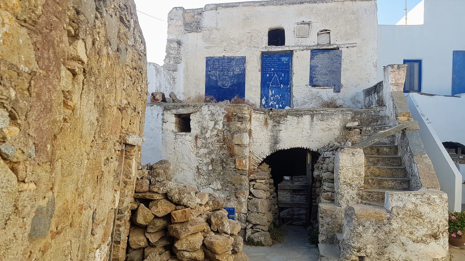 Poetry written on buildings in Volax village, Tinos