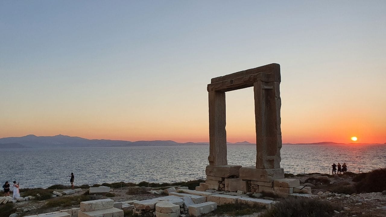 By staying in Chora in Naxos, you will be near the magnficent Portara as shone at sunset in this photo
