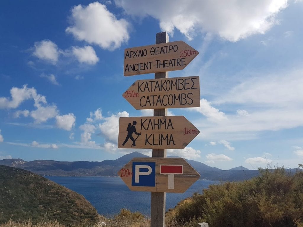 Signposts on a hiking trail in Milos