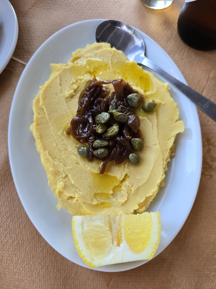 A dish of Greek fava, served with capers and caramelised onions
