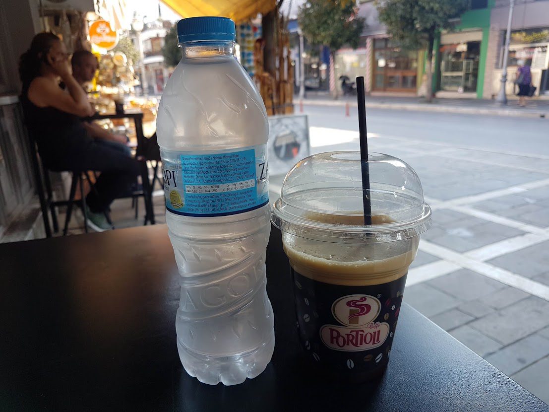 How to avoid single use plastics when we travel like this plastic water bottle and coffee