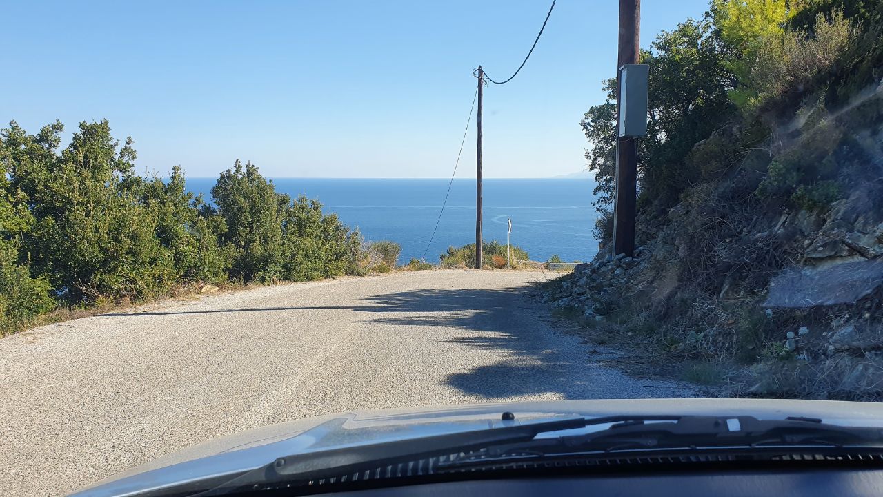 driving on the road in skopelos island in greece