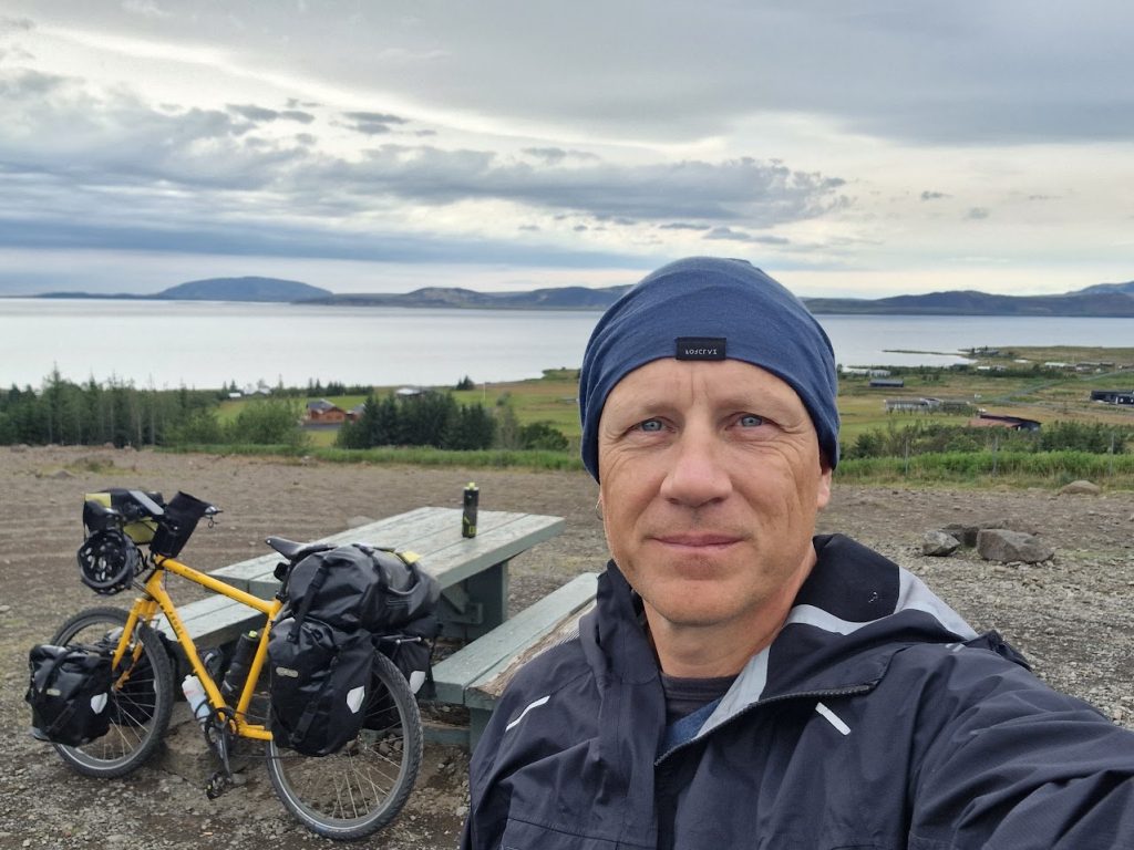 Dave cycling in Iceland with a waterproof jacket