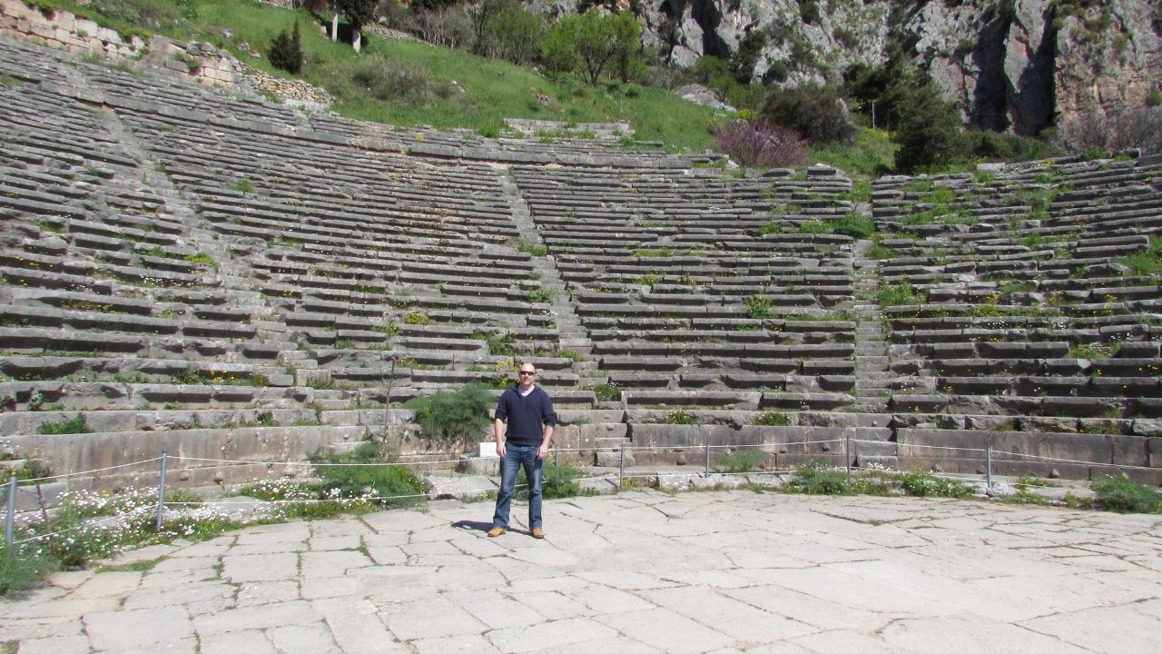 Dave Briggs standing in the ancient theatre in Delphi