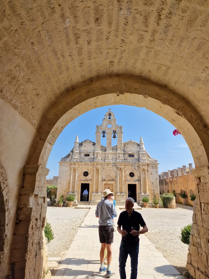 entering arkadi monastery through the arched gateway