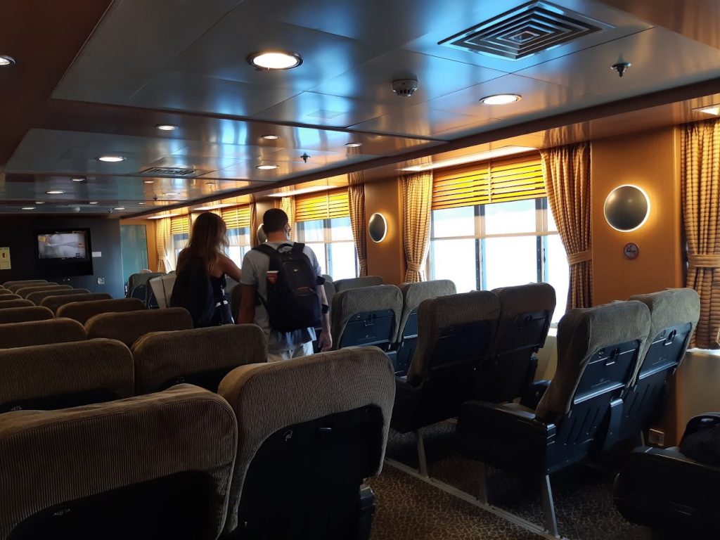 Numbered seating inside a greek ferry
